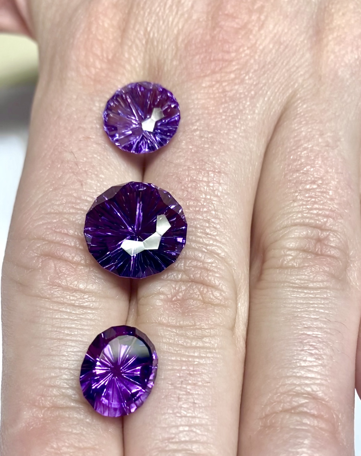 loose amethyst gemstones, fantasy cut oval and round amethysts