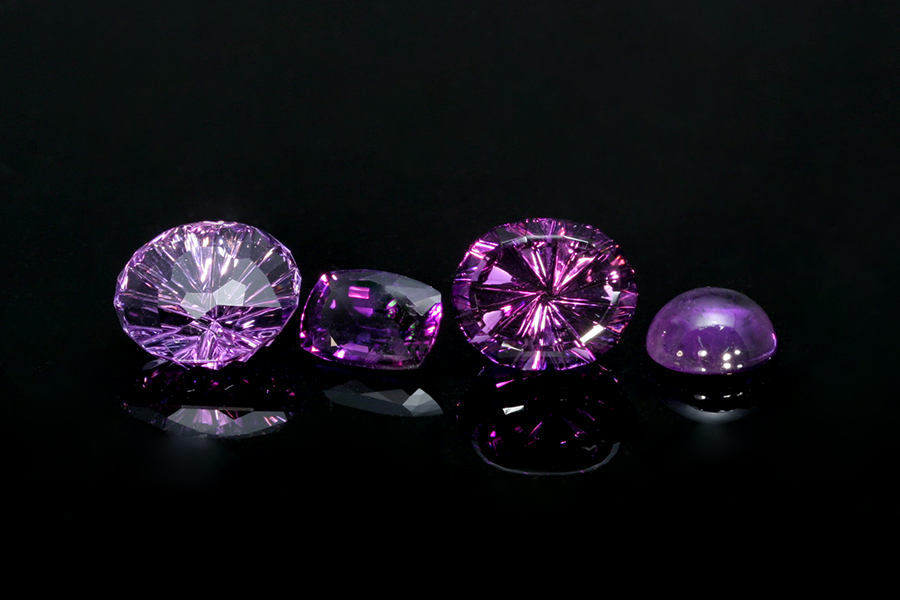 loose, vibrant purple amethyst gemstones, fantasy cut oval and round amethysts 